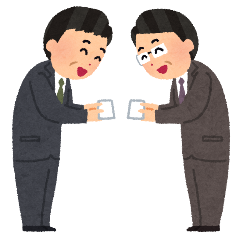 名刺交換をする男性たち